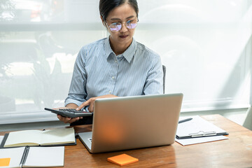 Business woman talking a video conference with partner about financial planning and press on...