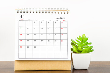 The November desk calendar 2021 with plant pot.