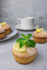 lemon muffin on a light background, lemon, mint, tea party, breakfast, cupcakes
