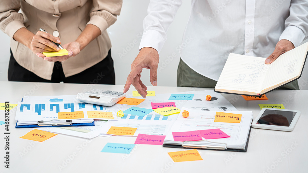 Poster business people team, boss holding book and pointing data on the table to explaining about new busin