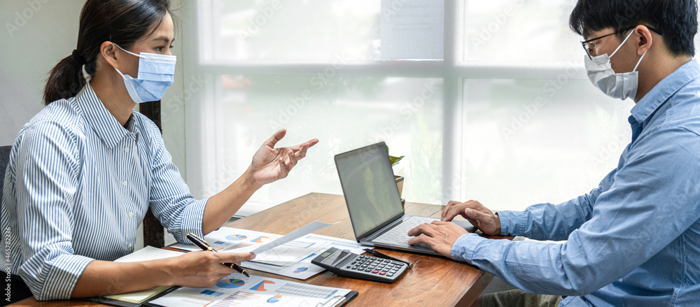 Aufkleber Two business colleagues holding data document and typing business data on laptop during brainstorming