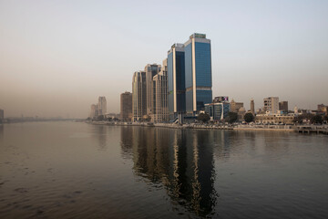 Obraz premium reflection of modern buildings in the Nile of Cairo Egypt
