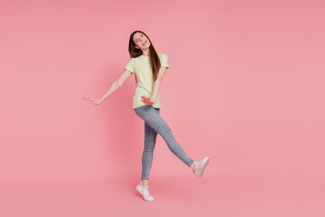 Full-length photo of young cheerful woman happy positive smile have fun playful isolated over pink color background