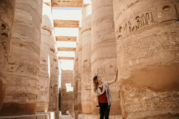 Female Traveler exploring ancient Karnak Temple in Luxor Egypt