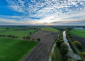 Fototapeta na wymiar canal Dessel Schoten panoramic aerial photo in Rijkevorsel, kempen, Belgium, showing the waterway in the natural green agricultural landscape. High quality photo