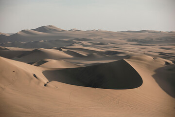 Fototapeta na wymiar desert sand dunes in Peru shade