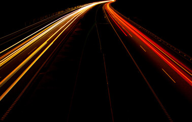 Night road lights. Lights of moving cars at night. long exposure red, blue, green