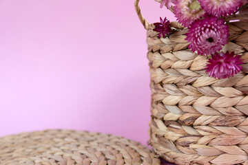 Purple flowers on water hyacinth hand made basket.