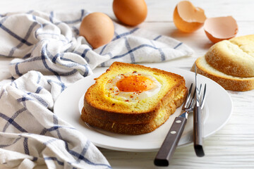 Croque madame sandwich. Breakfast. Hot sandwich of white wheat bread with ham, cheese, bechamel sauce and egg. French cuisine. Selective focus