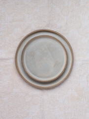 empty grey plates and linen napkin. Cooking background. Rustic style. Selective focus. Top view, copy space