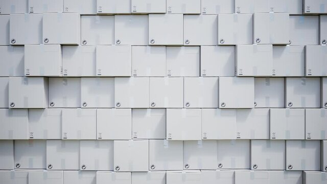 Wall of stacked white cardboard shipping boxes in a warehouse