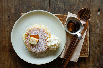 pancakes with butter and milk cream with honey.
