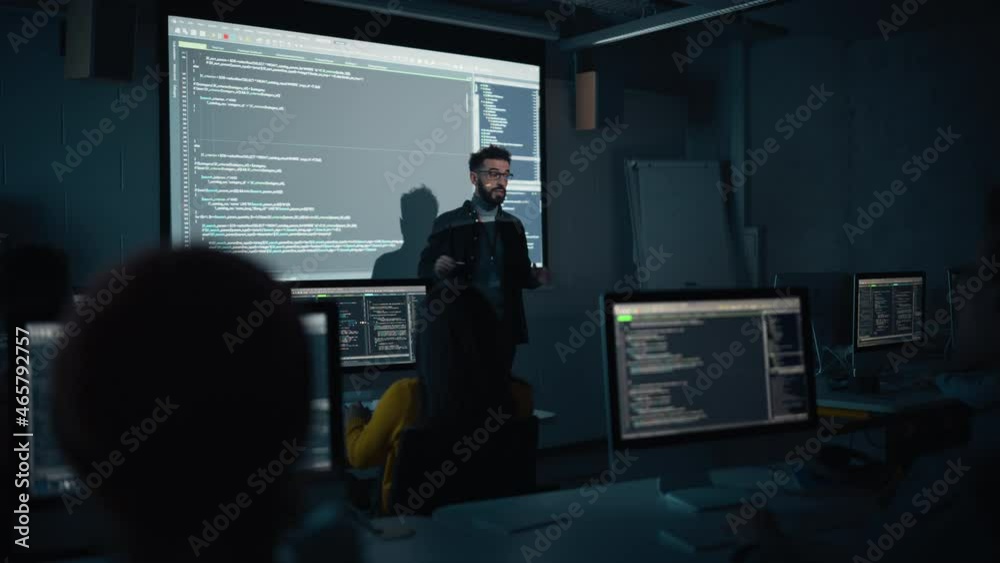 Aufkleber Teacher Giving Computer Science Lecture to Diverse Multiethnic Group of Female and Male Students in Dark College Room. Projecting Slideshow with Programming Code. Explaining Information Technology.