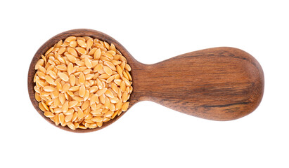 Golden flax seeds in wooden spoon, isolated on white background. Heap of dry flaxseed or linseed. Top view.