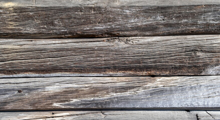 Background from old wooden boards with an interesting texture. Textured wood pattern. Photos of boards fitted to each other.