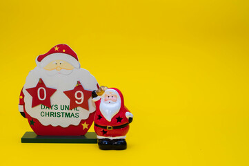 Christmas calendar counting down the days of a wooden Santa Claus