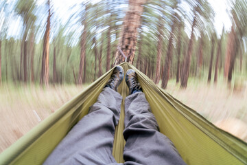 Swinging in a hammock in the Rocky Moutains © Leland