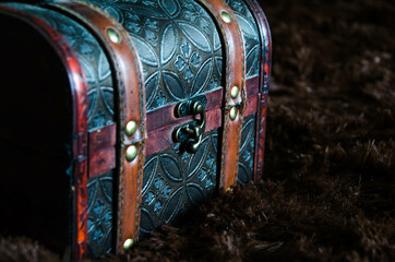 old chest, small box for jewelry, on a dark background