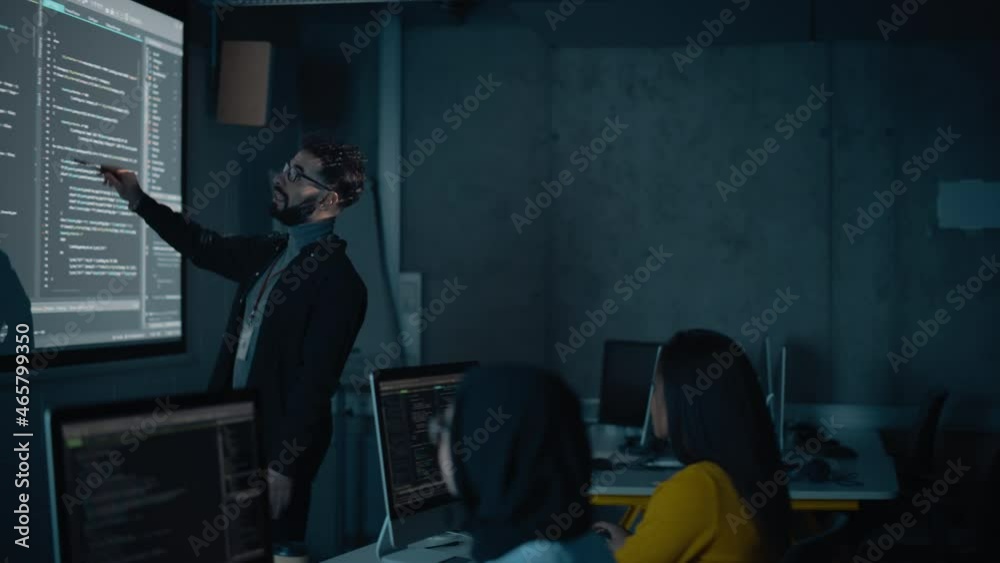 Aufkleber Teacher Giving Computer Science Lecture to Diverse Multiethnic Group of Female and Male Students in Dark College Room. Projecting Slideshow with Programming Code. Explaining Information Technology.