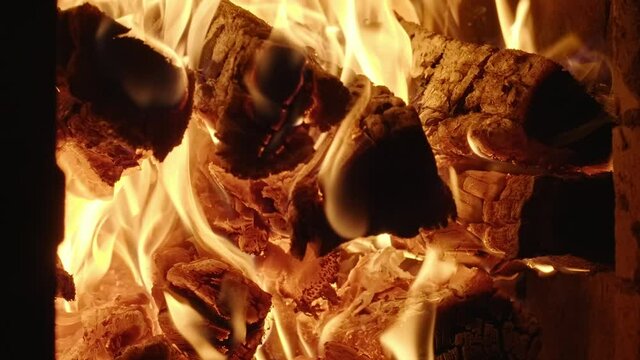 Close-up footage of burning wood in rustic oven