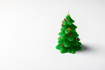 Christmas tree green decorative candle isolated on white background