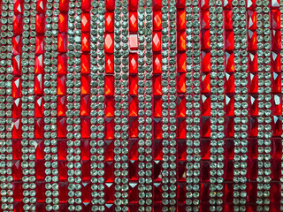 rows of stones on a red fabric