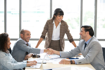 Fototapeta premium businessman working and shaking hands together for success a job in meeting room