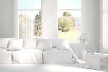 Stylish room in white color with sofa and autumn landscape in window. Scandinavian interior design. 3D illustration