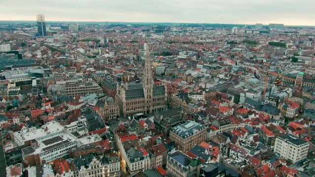 Establishing Aerial Shot of Brussels Skyline, Capital of Belgium. The Grand Place - picturesque old square in Europe. Popular tourist destination with medieval architecture. 4K drone panoramic video