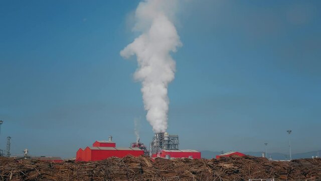Wood factory in Sebeş, Romania, 2021. Pollution environment with smoke. Ecological environment pollution.