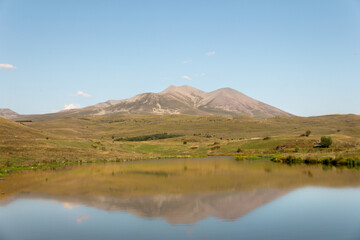 Mountain lake in autumn. 
View of the mountain with beautiful lake.