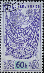 Czechoslovakia Circa 1958: A postage stamp printed in Czechoslovakia showing various textiles at the Universal and International Exposition at Brussels