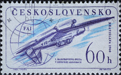 Czechoslovakia Circa 1960: A postage stamp printed in Czechoslovakia showing a Zlin Z-226 in aerobatics overhead. 1st aerobatic world championships