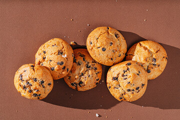 chocolate chip cookies close-up on brown background