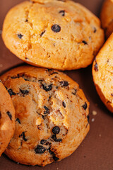 chocolate chip cookies close-up on brown background