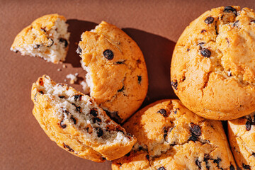 chocolate chip cookies close-up on brown background