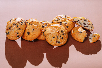 chocolate chip cookies close-up on brown background