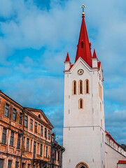 Fototapeta premium Cesis St. John Evangelical Lutheran Church on a dark autumn evening. High contrast HDR photo image, artistic graininess of the image. 
