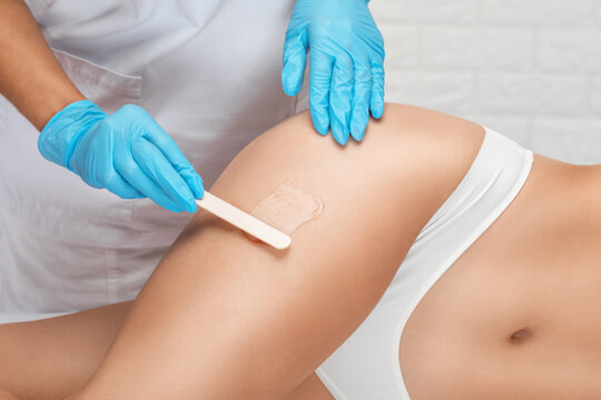 Elos epilation hair removal procedure on a woman&rsquo;s body. Beautician doing laser rejuvenation in a beauty salon. Removing unwanted body hair. Hardware ipl cosmetology