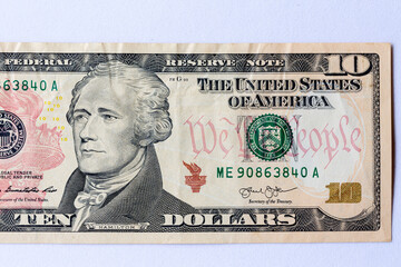 Alexander Hamilton face on us ten dollar bill extreme macro, 10 usd on coins, United States money...