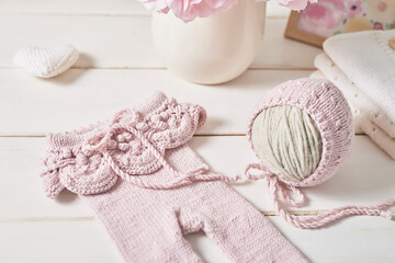 Knitted kids clothes and accessories for knitting. Needlework and knitting. Hobbies and creativity. Knit for children. Handmade