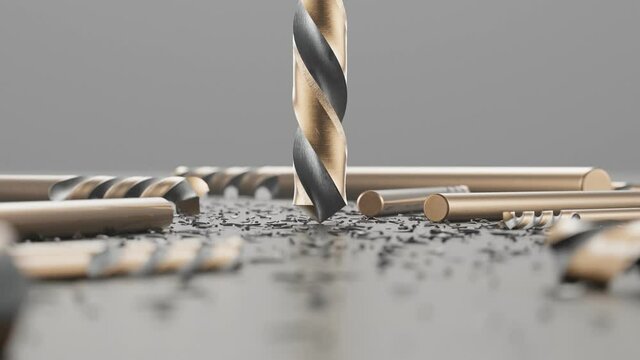 Shiny drill bits among metal shavings. High hardness beet ready to drill