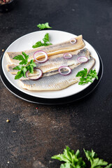 herring fish fillet seafood a portion ready to eat meal snack on the table copy space food background rustic. top view pescetarian diet
