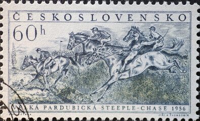 Czechoslovakia Circa 1956: A postage stamp printed in Czechoslovakia showing horse and rider at...