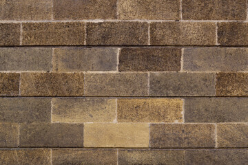 Brick wall background. Brown textured bricks.