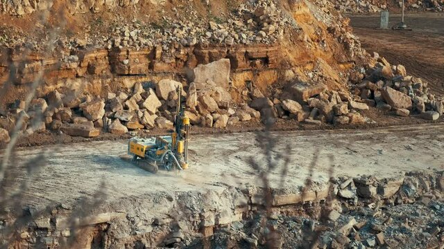 Russia, Kaluga region, Tovarkovo. Limestone quarry. On October 17, 2021, the drilling rig is drilling wells for laying explosive material.