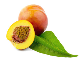 Juicy whole peach nectarine and half a peach on a white plate with green leaves. Peach on white background, isolate