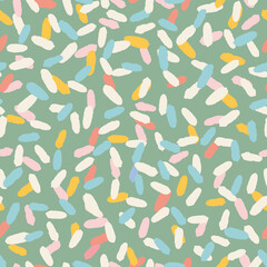 Colorful confetti strokes seamless repeat pattern. Random placed, vector lines all over print on sage green background.