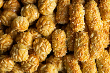 Panellets, traditional sweet dessert from Barcelona and Valencia made with potato, eggs, sugar and different nuts like almonds or  pinions. 