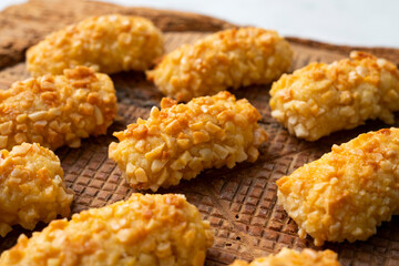 Panellets, traditional sweet dessert from Barcelona and Valencia made with potato, eggs, sugar and different nuts like almonds or  pinions. 